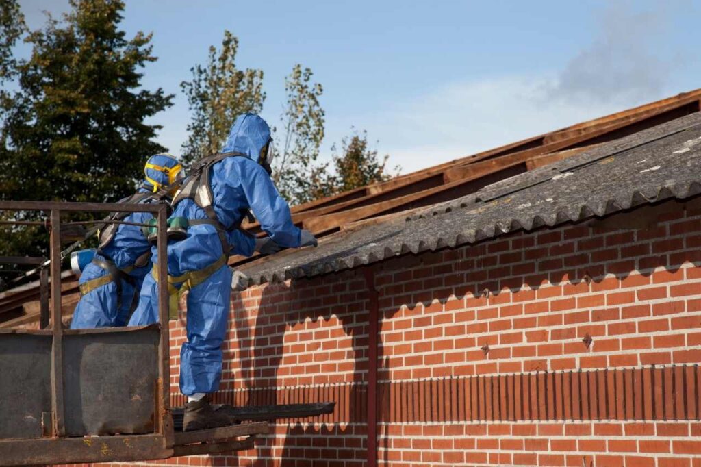 two asbestos removalists are working on asbestos roof removal in Brisbane